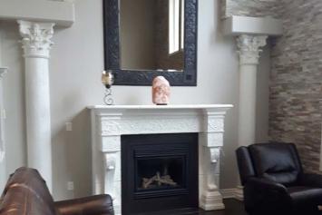 White painted columns and fireplace